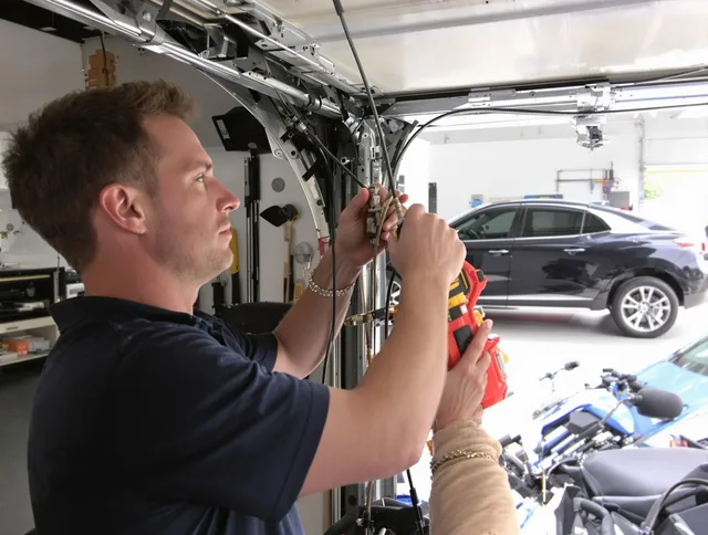 Bethel Garage Door Repair safety certified technician performing cable replacement in Bethel