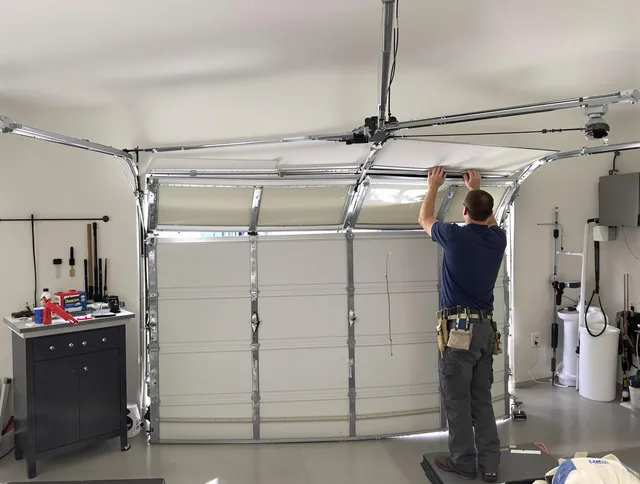 Bethel Garage Door Repair specialist performing precise section replacement on Bethel garage door